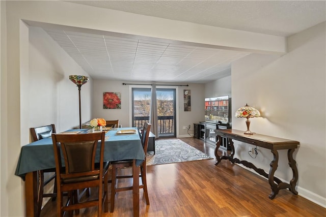 dining space featuring wood-type flooring