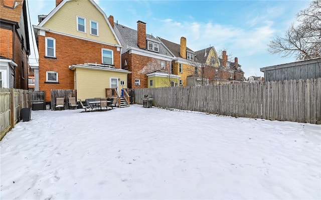 view of snow covered house