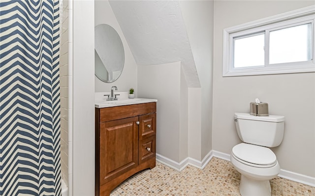 bathroom with a shower with curtain, vanity, and toilet