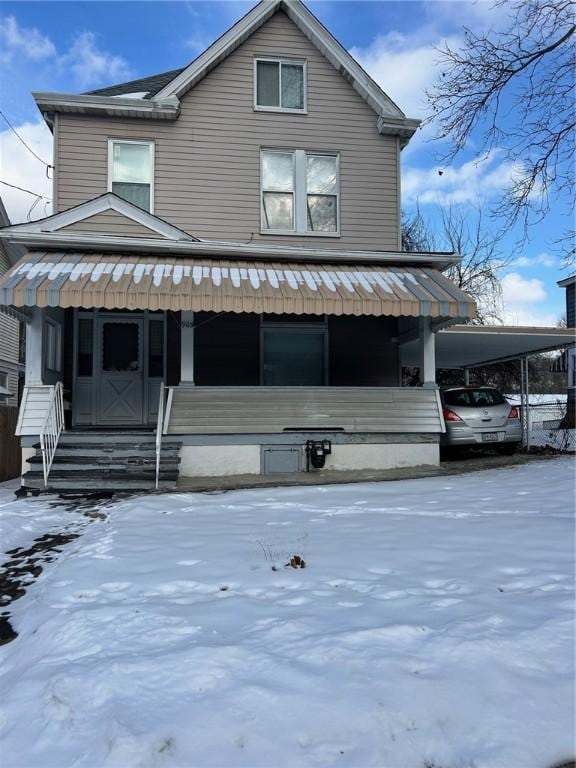 view of front of property with a carport