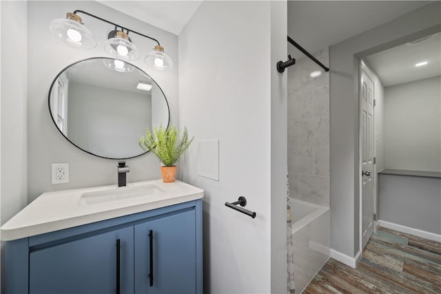 bathroom featuring vanity and tiled shower / bath combo