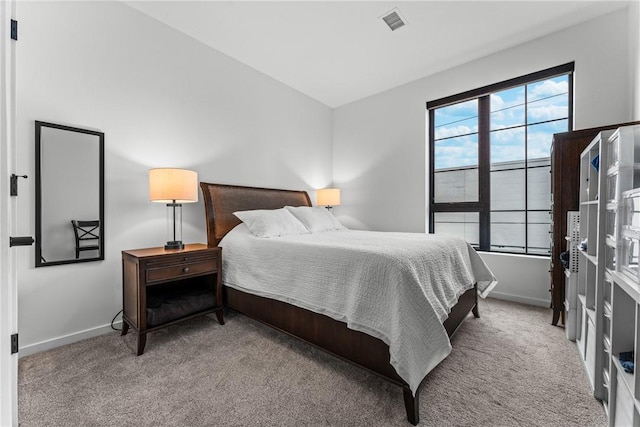 bedroom with light carpet