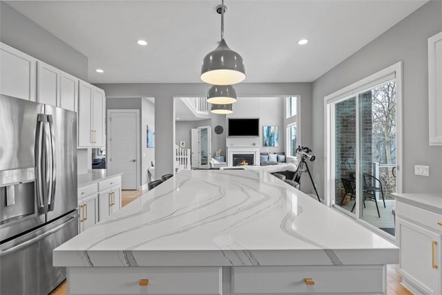 80 Charleston Sq, Bell Acres, PA 15143 - kitchen with stainless steel fridge, open floor plan, a kitchen island, white cabinets, and recessed lighting