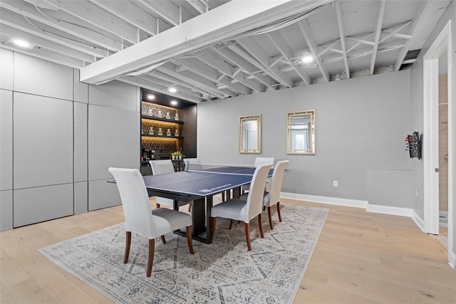80 Charleston Sq, Bell Acres, PA 15143 - dining area with wood finished floors, a bar, and baseboards