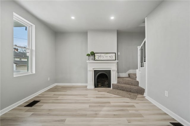 living room with light hardwood / wood-style floors