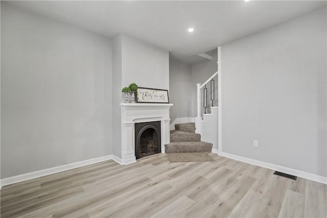 unfurnished living room with light hardwood / wood-style floors