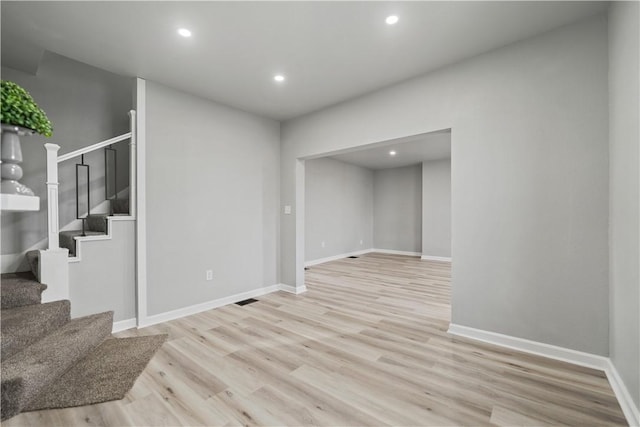 empty room with light hardwood / wood-style floors