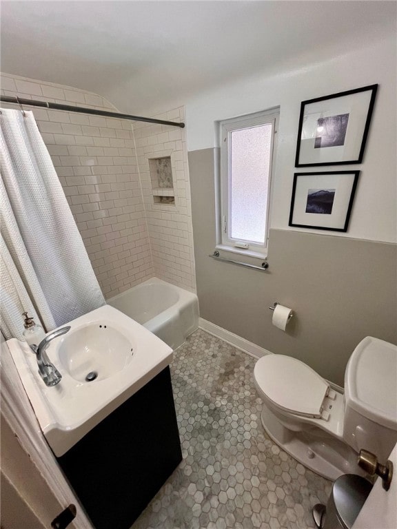 full bathroom with vanity, toilet, and shower / tub combo