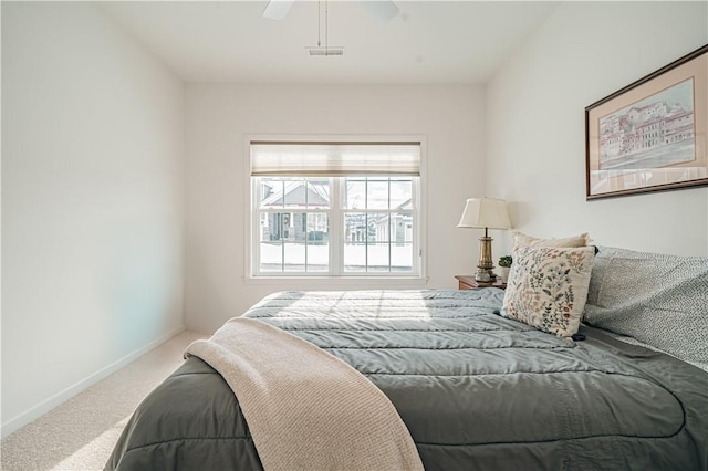 bedroom with ceiling fan and carpet floors