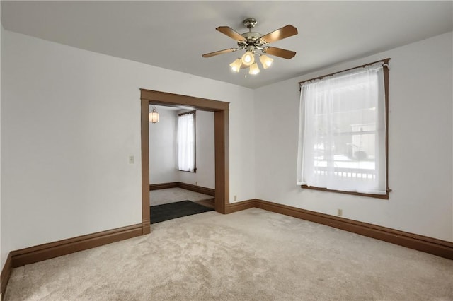 spare room with ceiling fan and carpet flooring