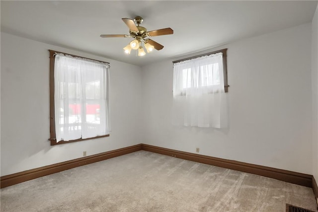 carpeted empty room with ceiling fan