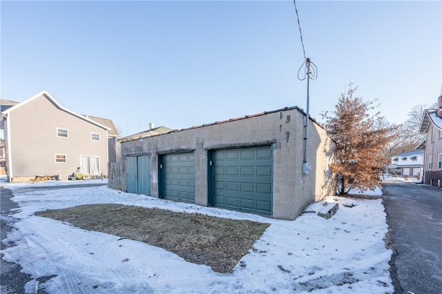 view of snow covered garage