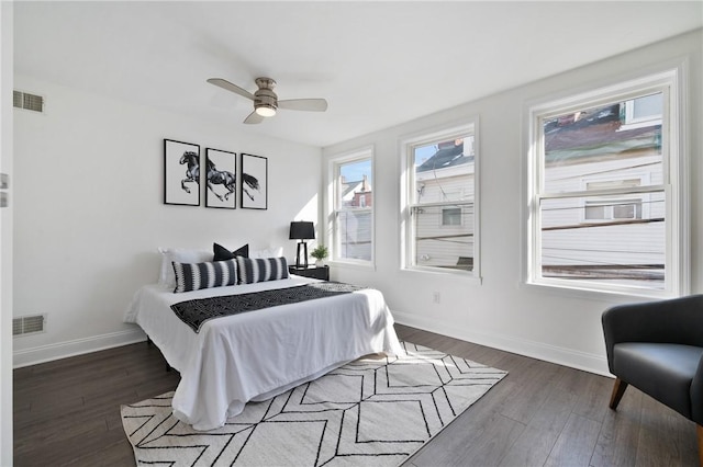 bedroom featuring dark wood-type flooring and ceiling fan