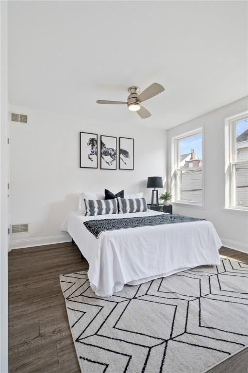 bedroom featuring dark wood-type flooring and ceiling fan