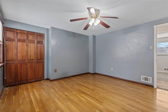 unfurnished bedroom featuring ceiling fan and light hardwood / wood-style flooring