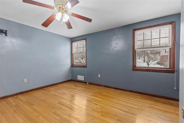 unfurnished room featuring ceiling fan and light wood-type flooring