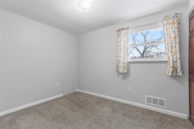 unfurnished room featuring carpet flooring