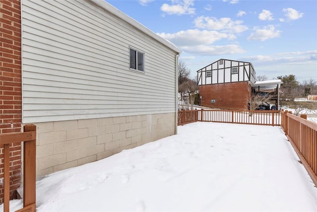 view of yard layered in snow