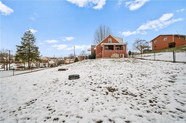 view of yard layered in snow