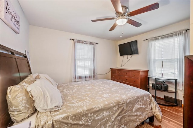 bedroom featuring hardwood / wood-style floors and ceiling fan