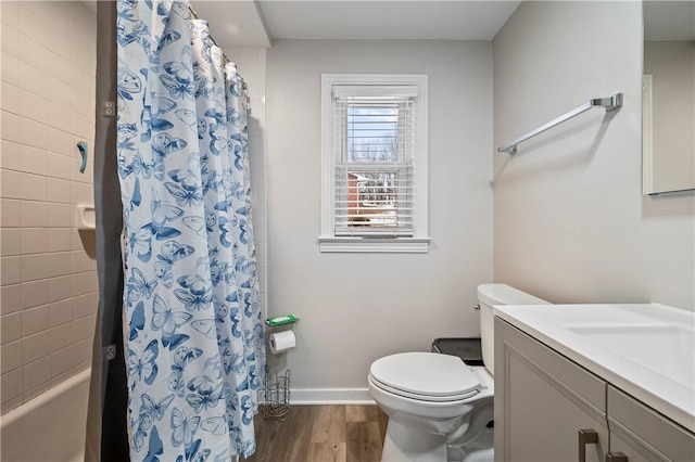 bathroom with vanity, hardwood / wood-style floors, toilet, and walk in shower