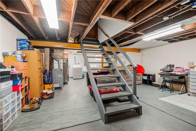 basement featuring washer / clothes dryer and water heater