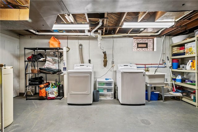 basement with sink and independent washer and dryer