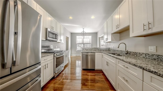 kitchen with white cabinetry and appliances with stainless steel finishes