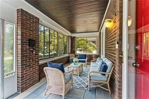 sunroom featuring wooden ceiling