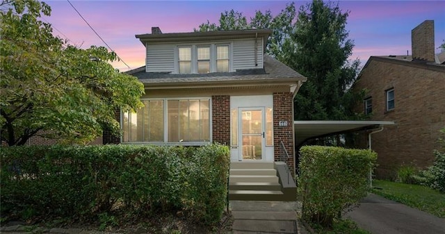 view of front of property featuring a carport