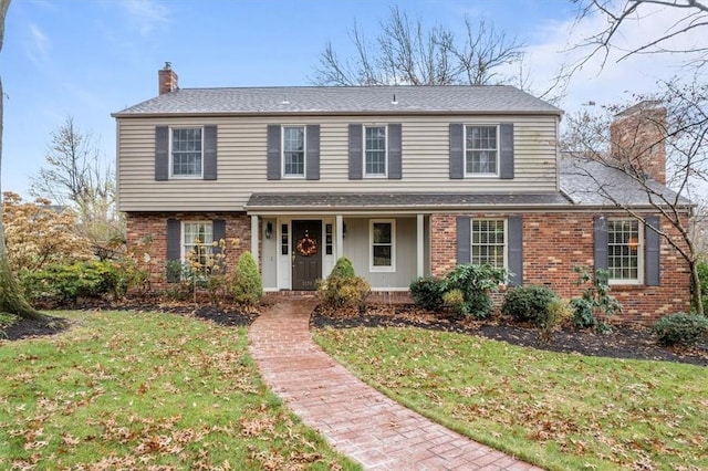 view of front property with a porch and a front lawn