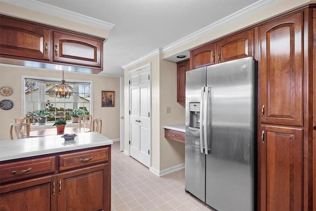 kitchen with stainless steel refrigerator with ice dispenser and ornamental molding