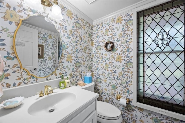 bathroom featuring ornamental molding, toilet, and vanity