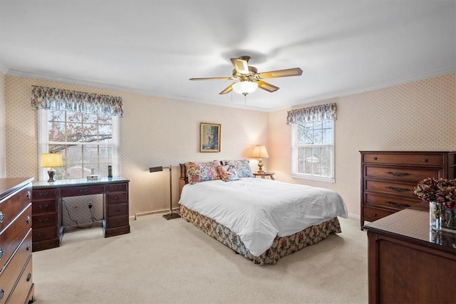 carpeted bedroom featuring multiple windows, ornamental molding, and ceiling fan