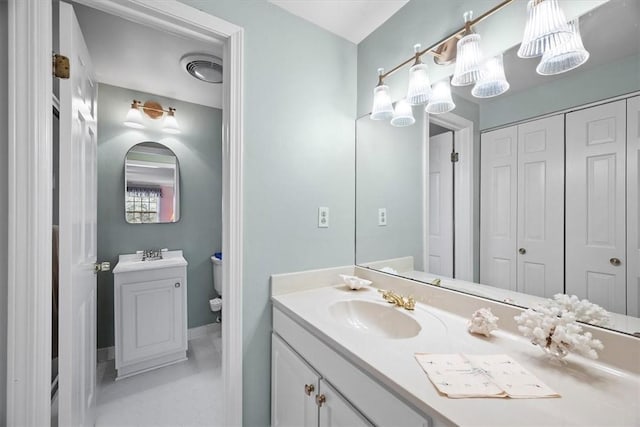 bathroom with vanity and toilet