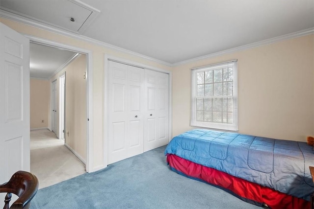 carpeted bedroom featuring ornamental molding and a closet