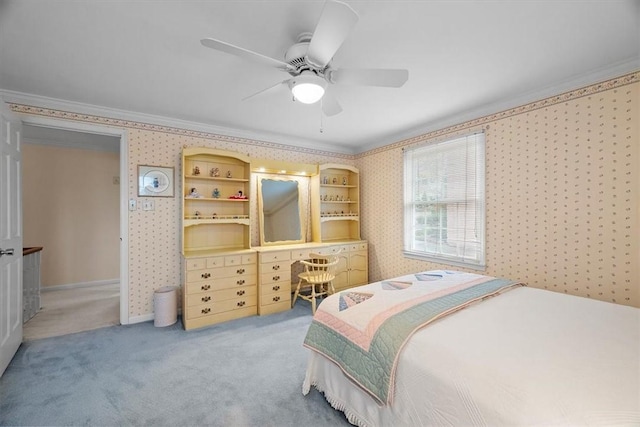 bedroom with ornamental molding, carpet, and ceiling fan