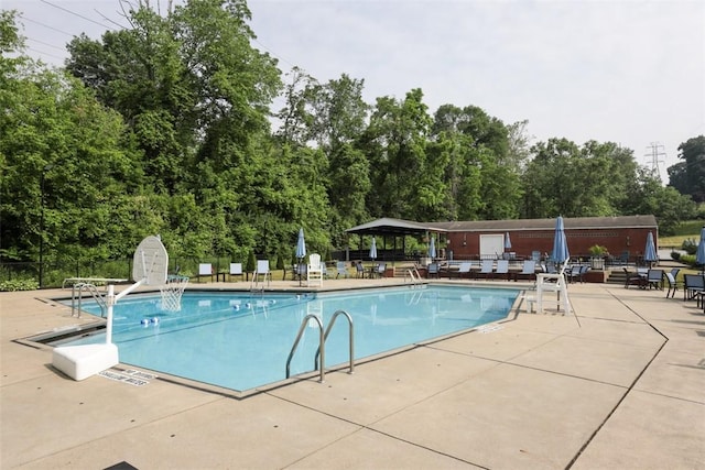 view of swimming pool with a patio area