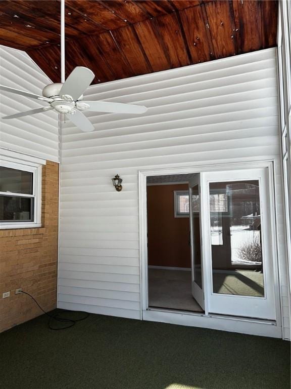 doorway to property with ceiling fan