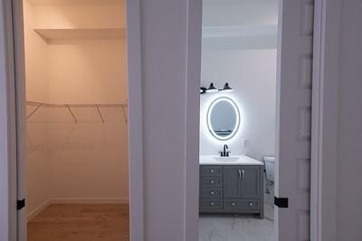 bathroom featuring hardwood / wood-style flooring, vanity, and toilet