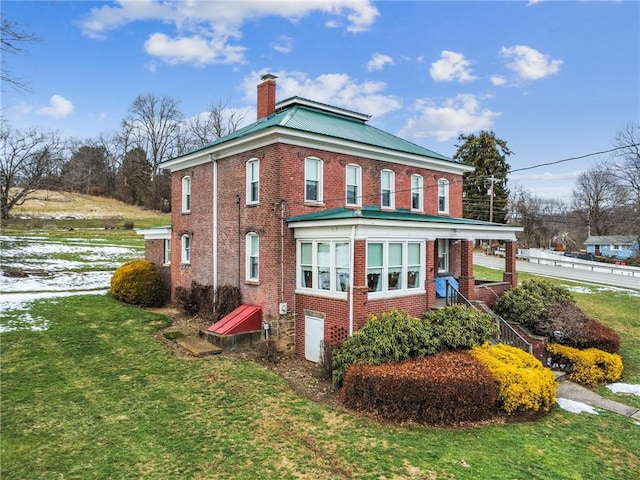 view of home's exterior featuring a yard