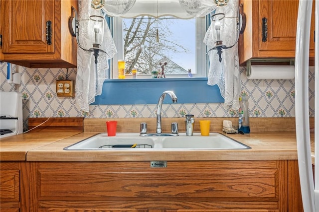 kitchen with sink and backsplash