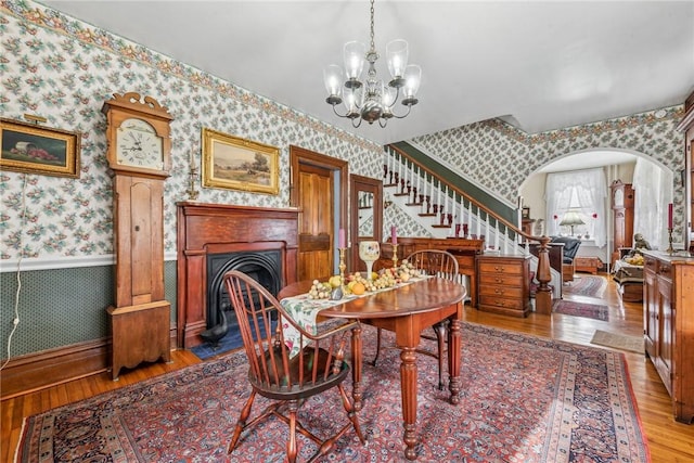 dining room with a chandelier and light hardwood / wood-style floors