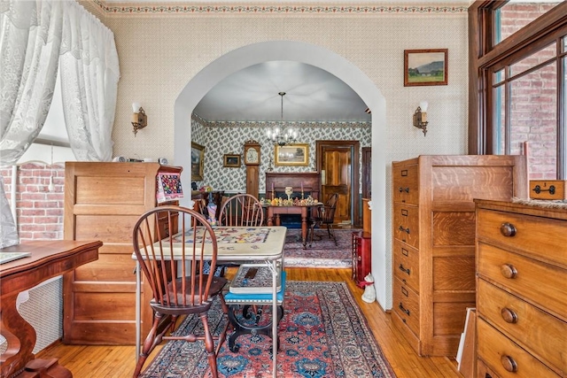 dining space featuring an inviting chandelier and light hardwood / wood-style flooring