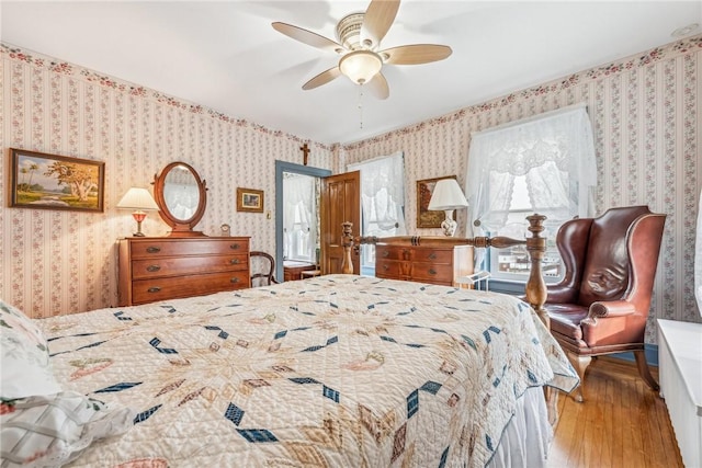 bedroom featuring light hardwood / wood-style flooring and ceiling fan