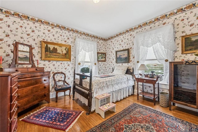 bedroom with wood-type flooring