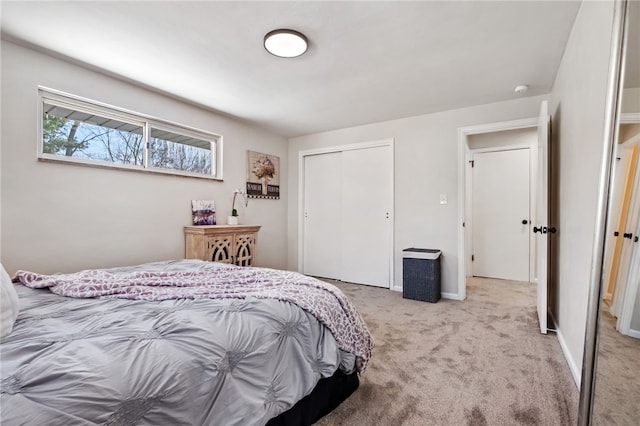 carpeted bedroom with a closet