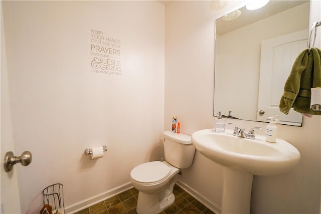 bathroom with toilet and sink