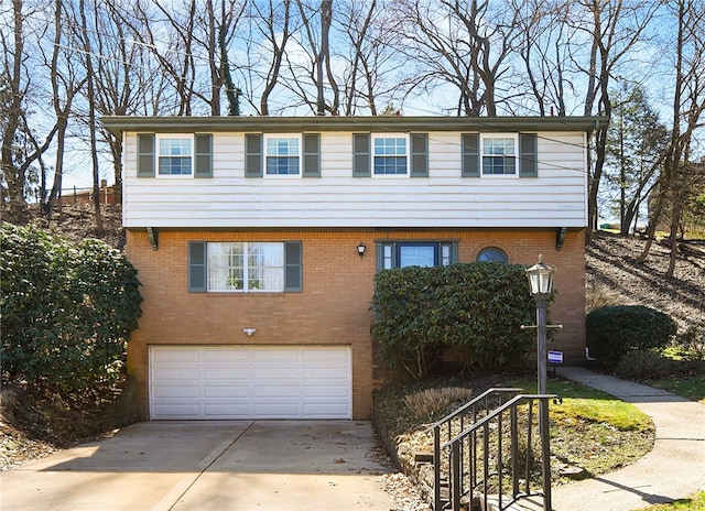 view of front of property with a garage, brick siding, and concrete driveway