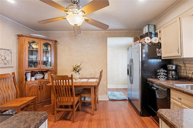 dining room with crown molding, ceiling fan, and light hardwood / wood-style flooring